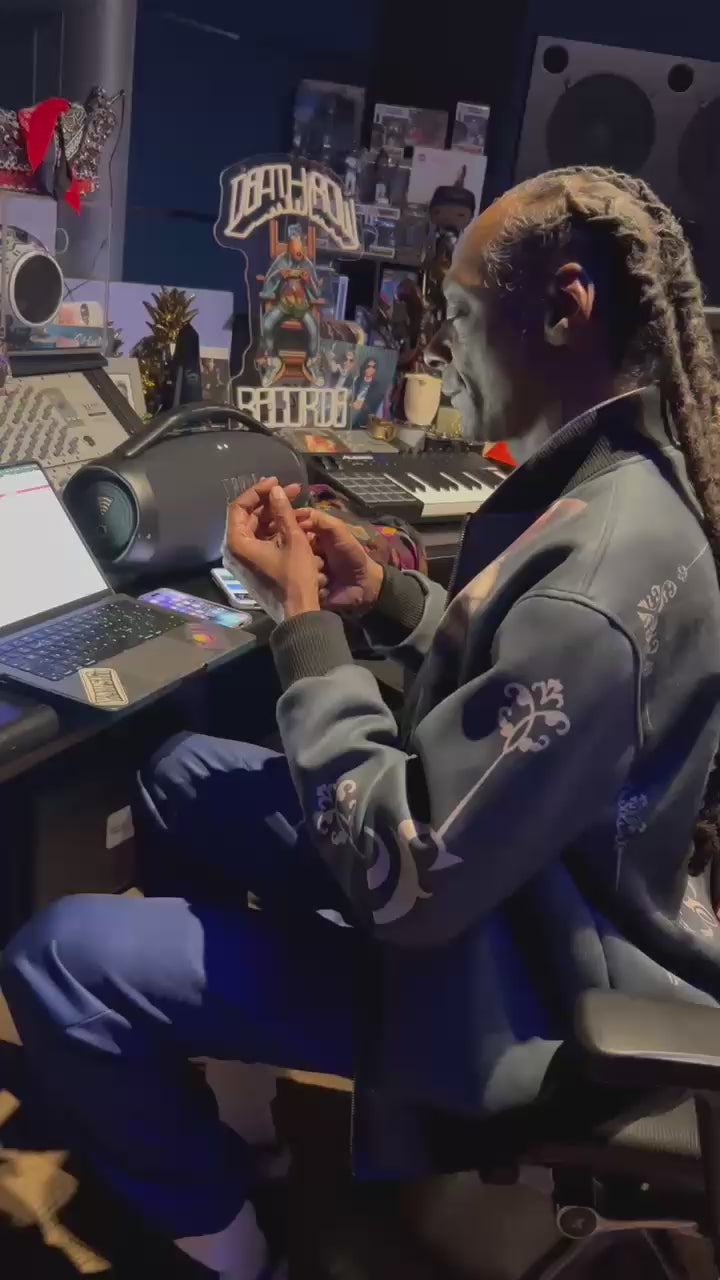 Load video: Snoop Dogg in a music studio confirming the authenticity of TryDeathRow.com and playing a theme song about his Death Row Records brands